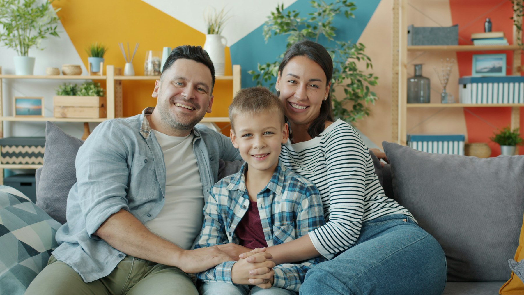 A smiling family at the dental office representing welcoming care at Gentle Dentistry in Lawrence, KS